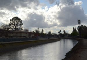 dark canal with bright clouds